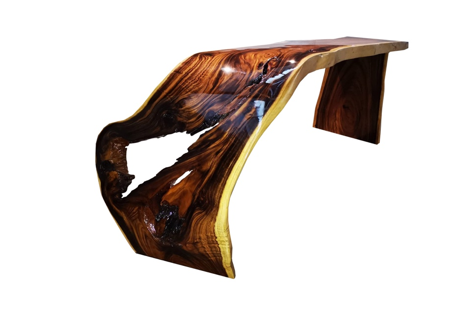 A wood coffee table with a live edge and high-end finishing