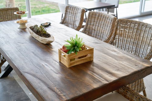 Wooden dining table and bamboo chairs