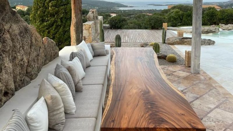 acacia wood table on a patio